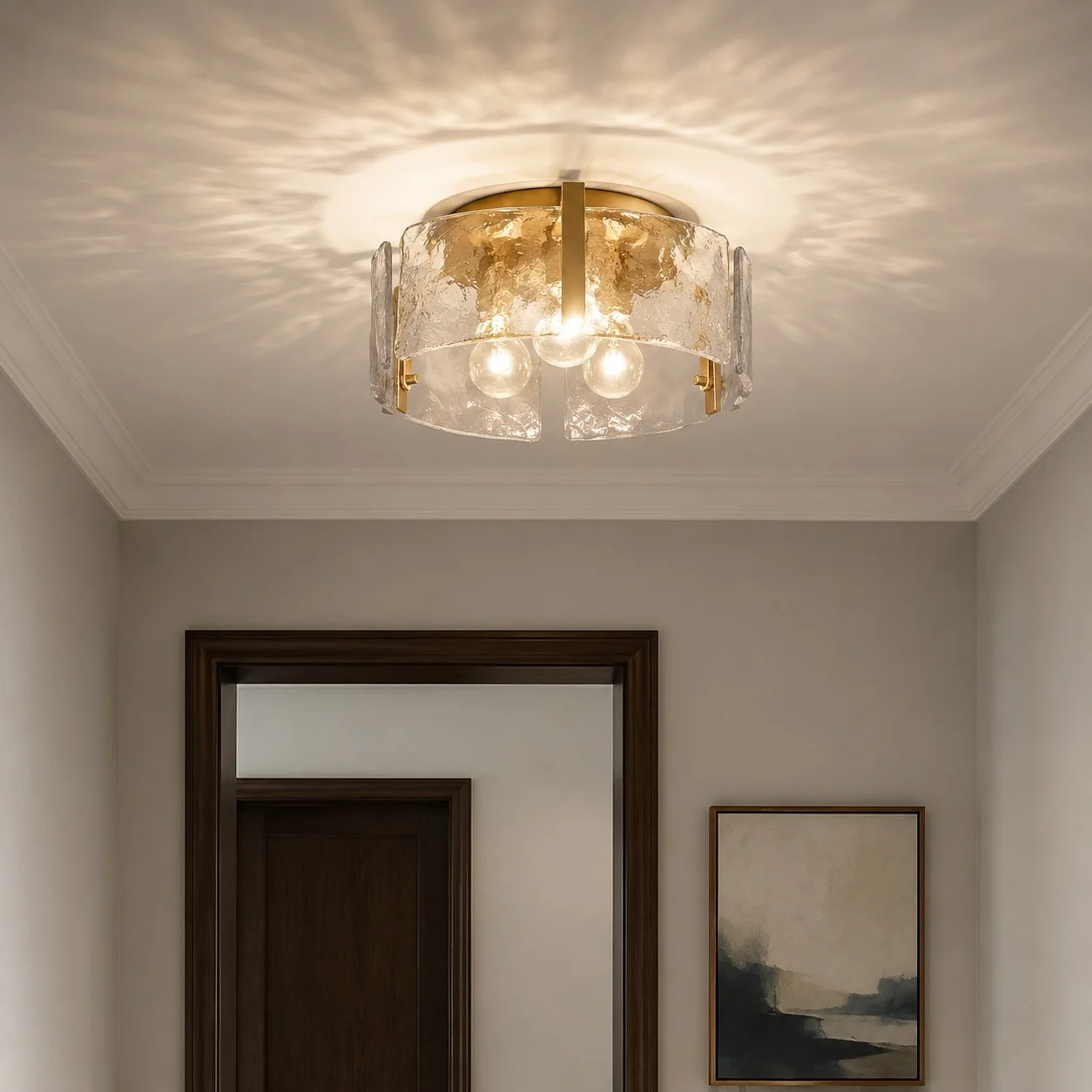 Lucien ripple glass ceiling light installed in a bright entryway with framed art