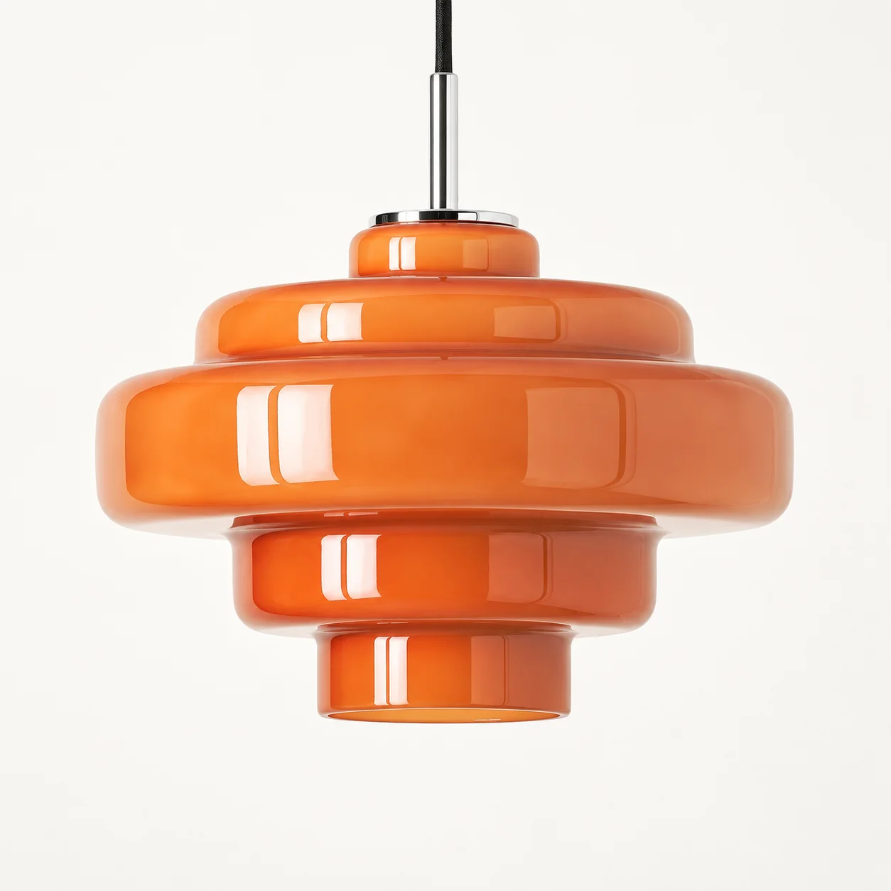 Close-up of the Orange pendant's rounded glass tiers and open lower rim