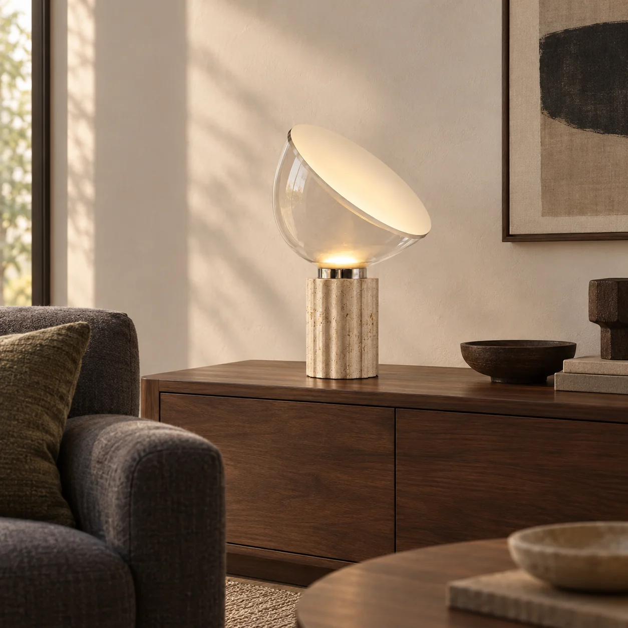 Soline travertine table lamp on a walnut console in a contemporary living room