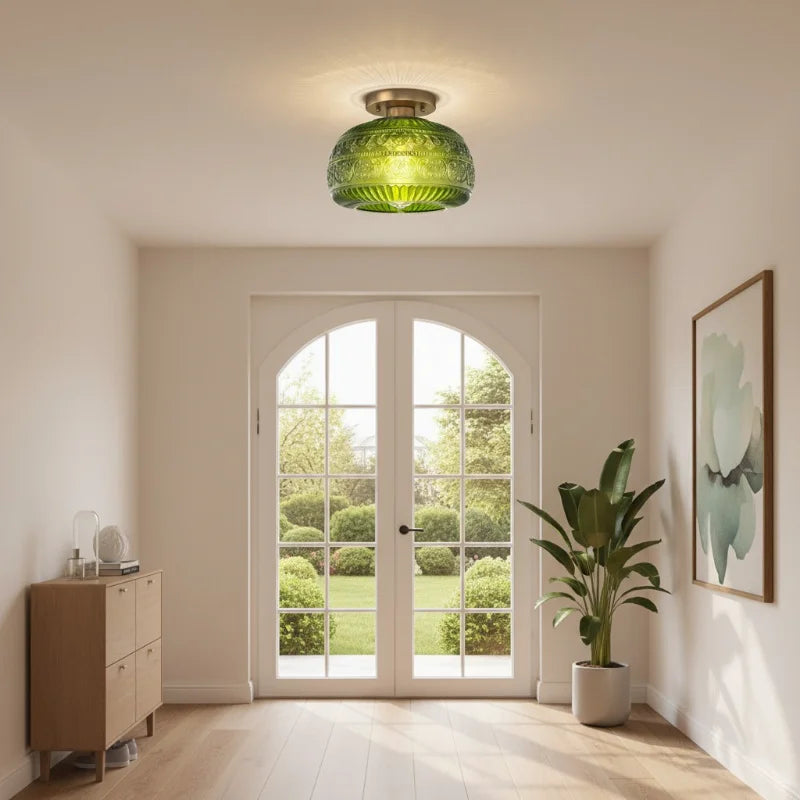 Oliver green carved glass ceiling light in an entryway