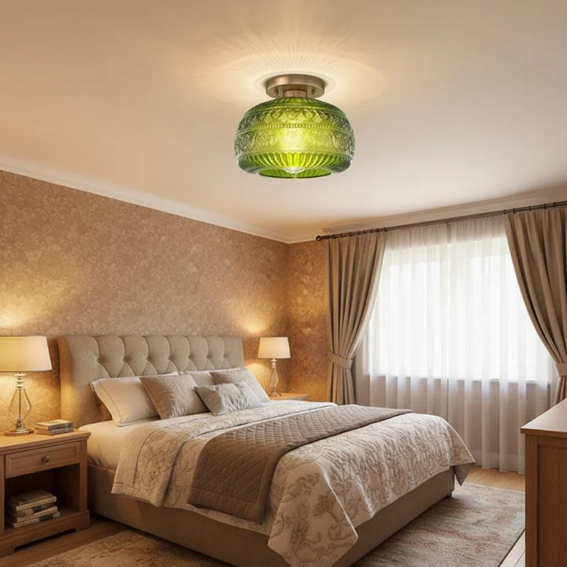 Oliver green carved glass ceiling light in a bedroom