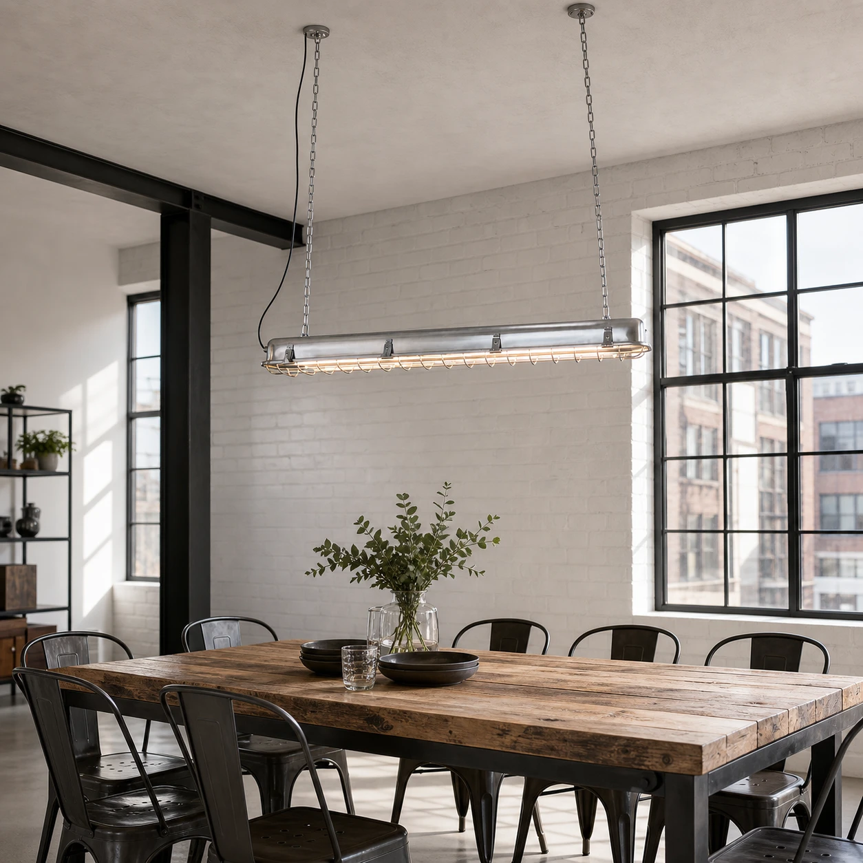 GTA Cage Linear Pendant Light above a long dining table