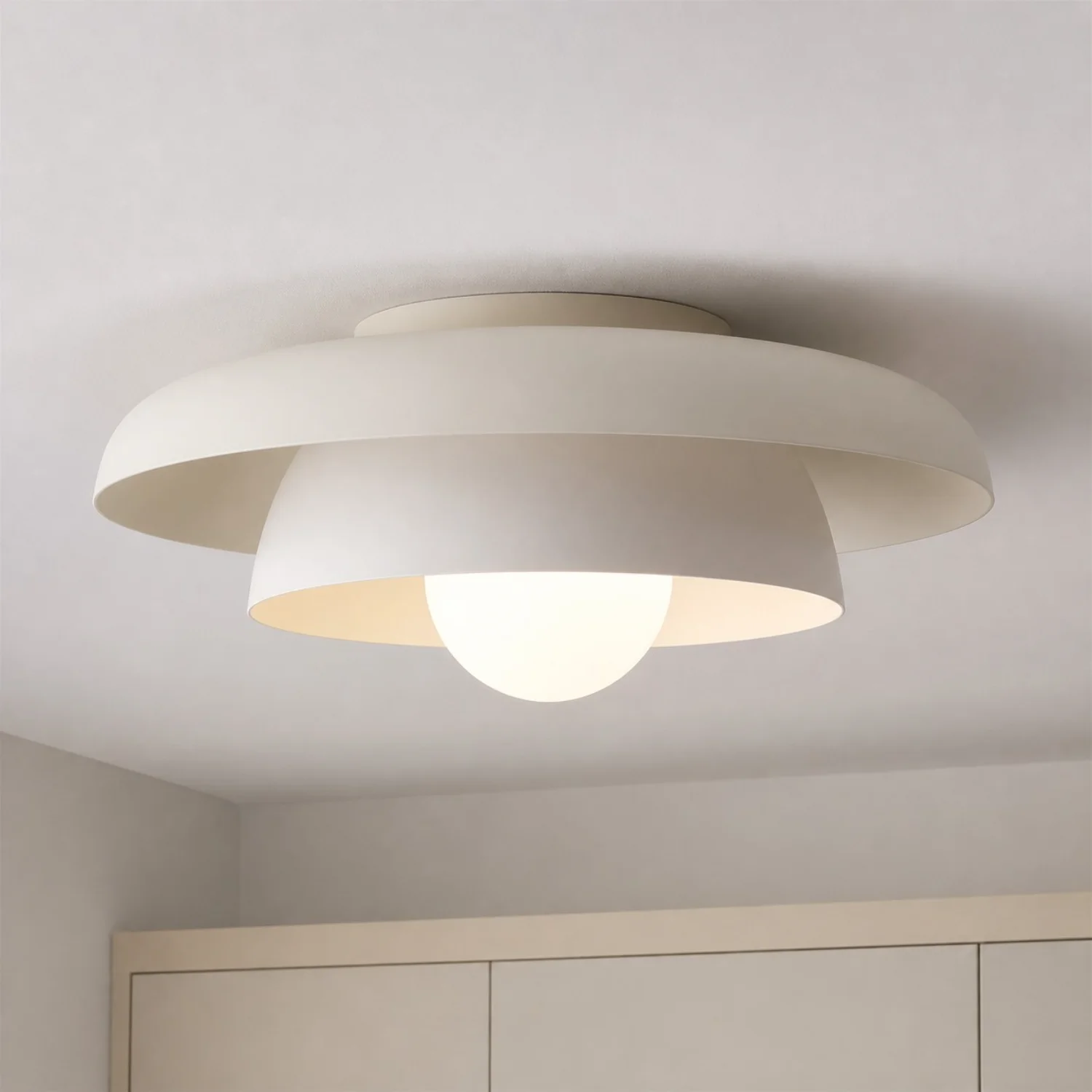 Cream-white Neso flush mount in a bright living area