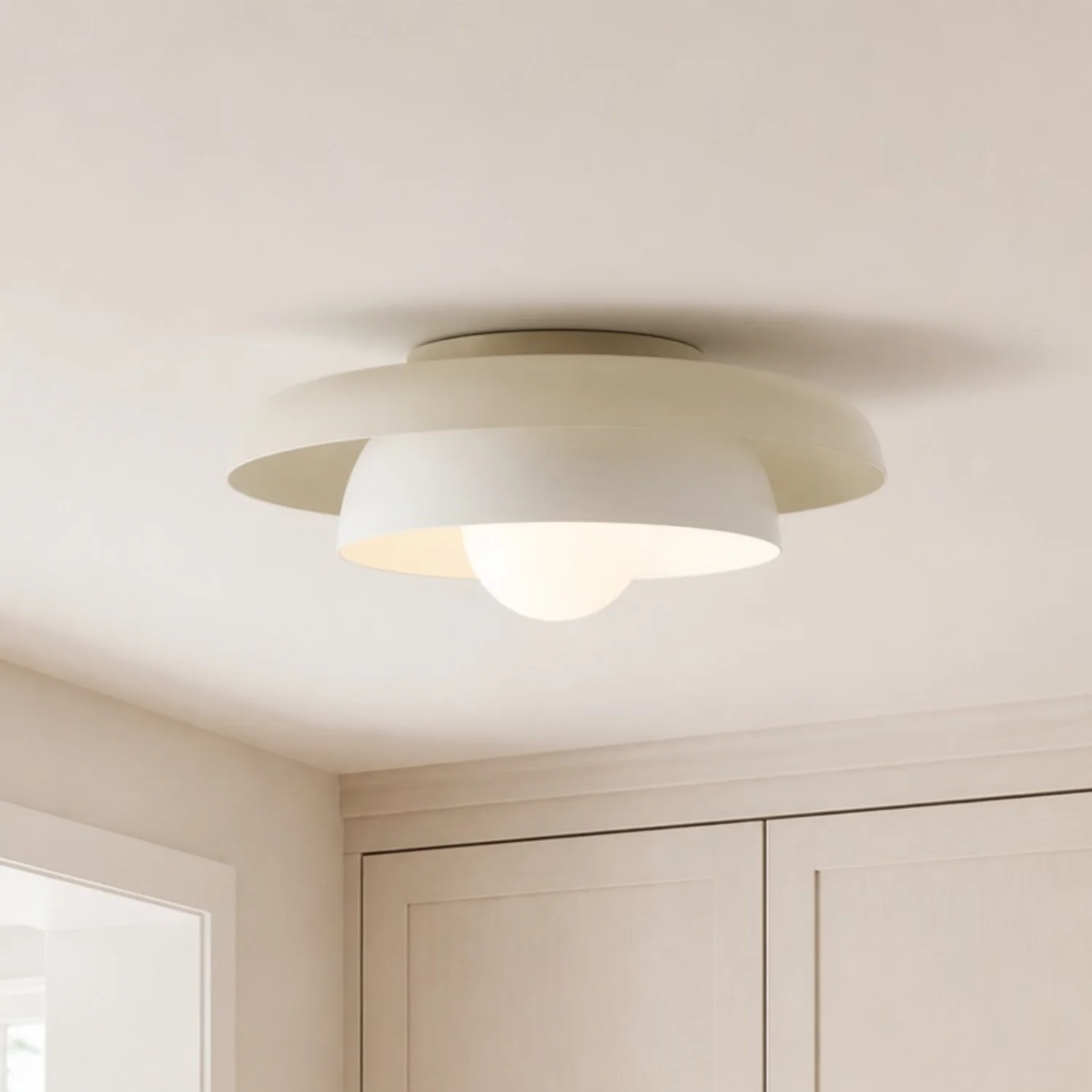 Cream-white Neso fixture in a quiet interior