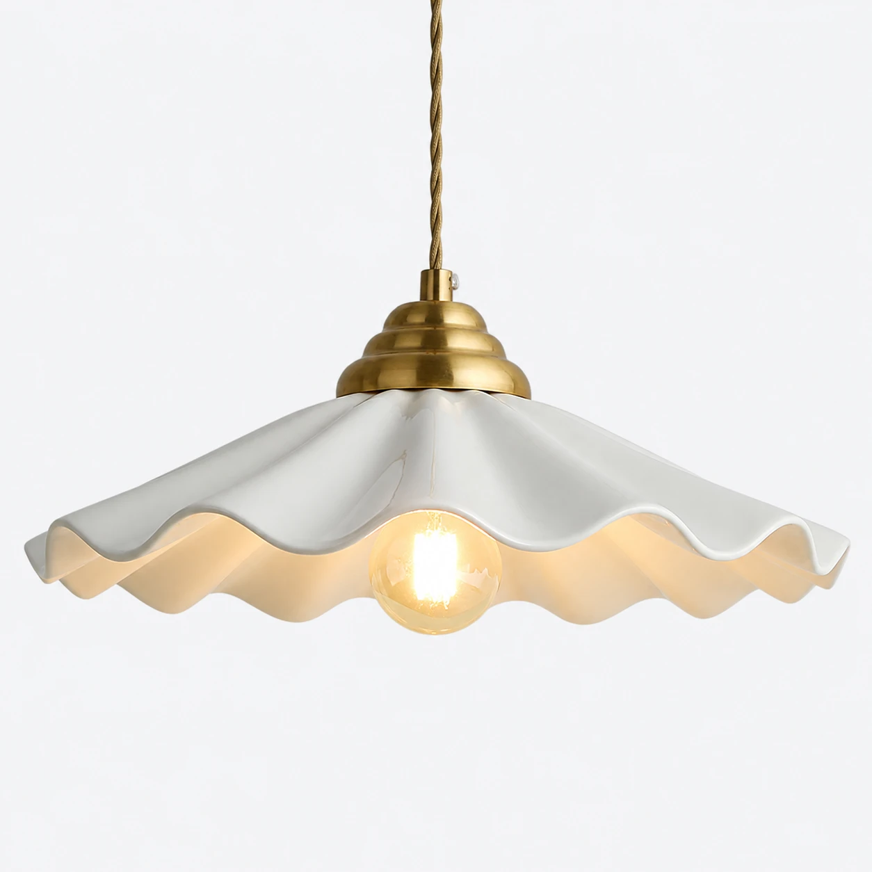 Wavy white ceramic flower pendant light with brass fitting
