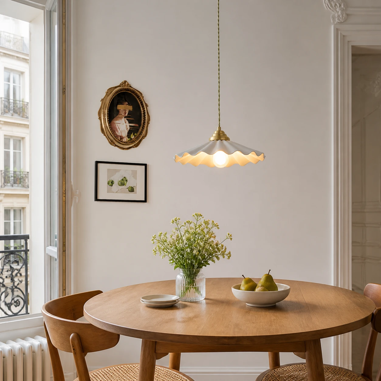 Wavy ceramic pendant over a round dining table