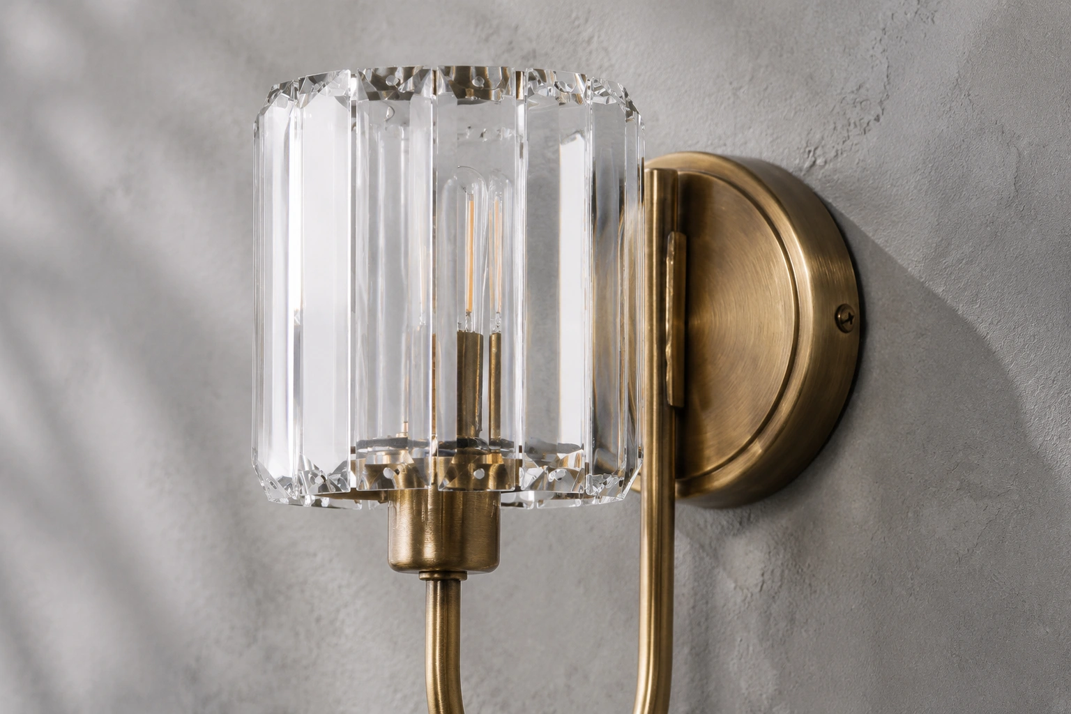 Close material view of clear faceted glass and antique brass