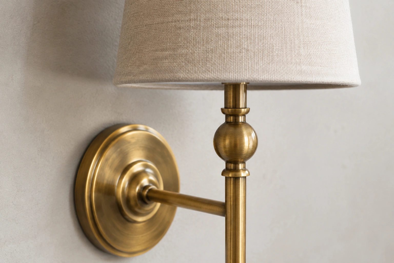 Close material view of natural faux linen and antique brass