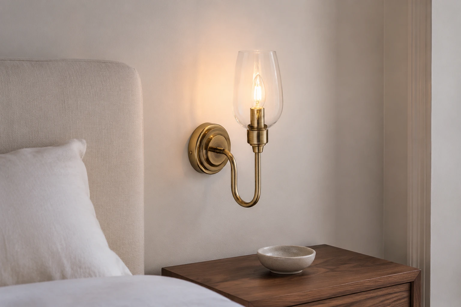 Amos wall light beside a bedroom headboard