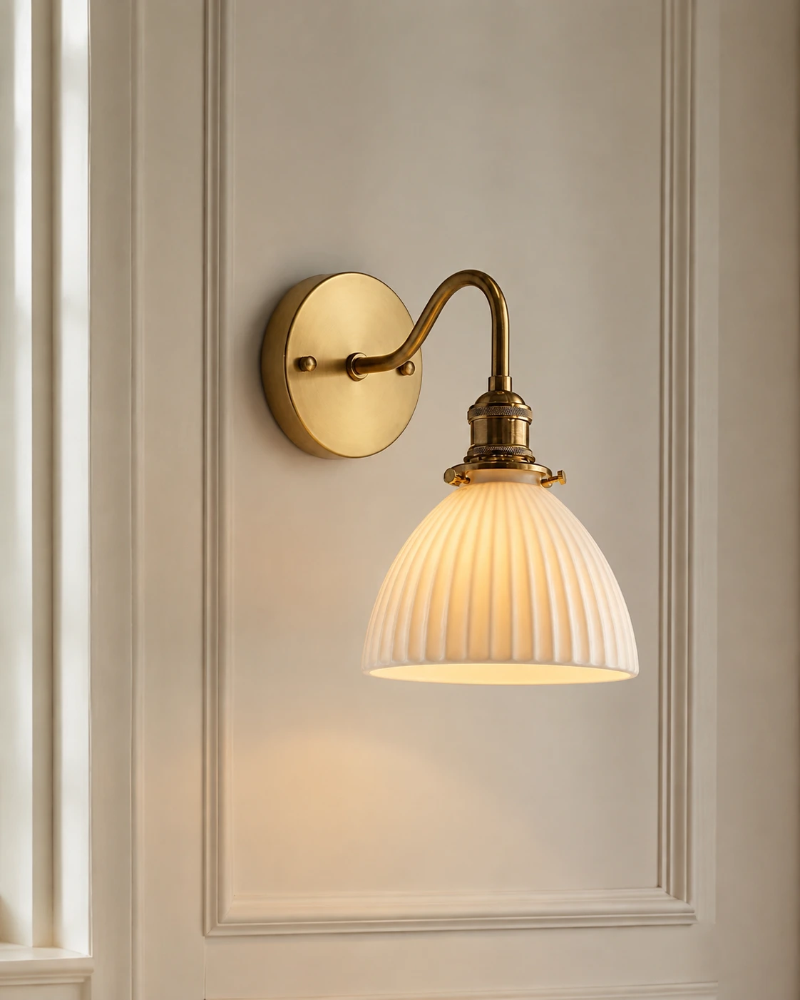Complete vintage brass ceramic wall sconce on a paneled wall