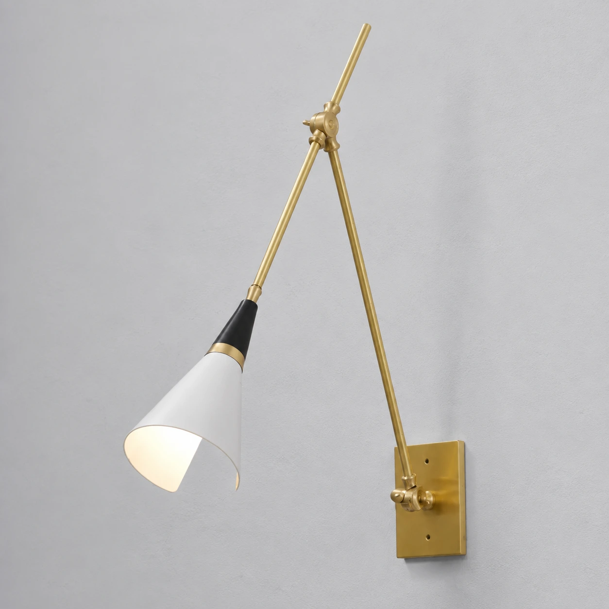 Magari wall lamp white shade and brass trim close-up