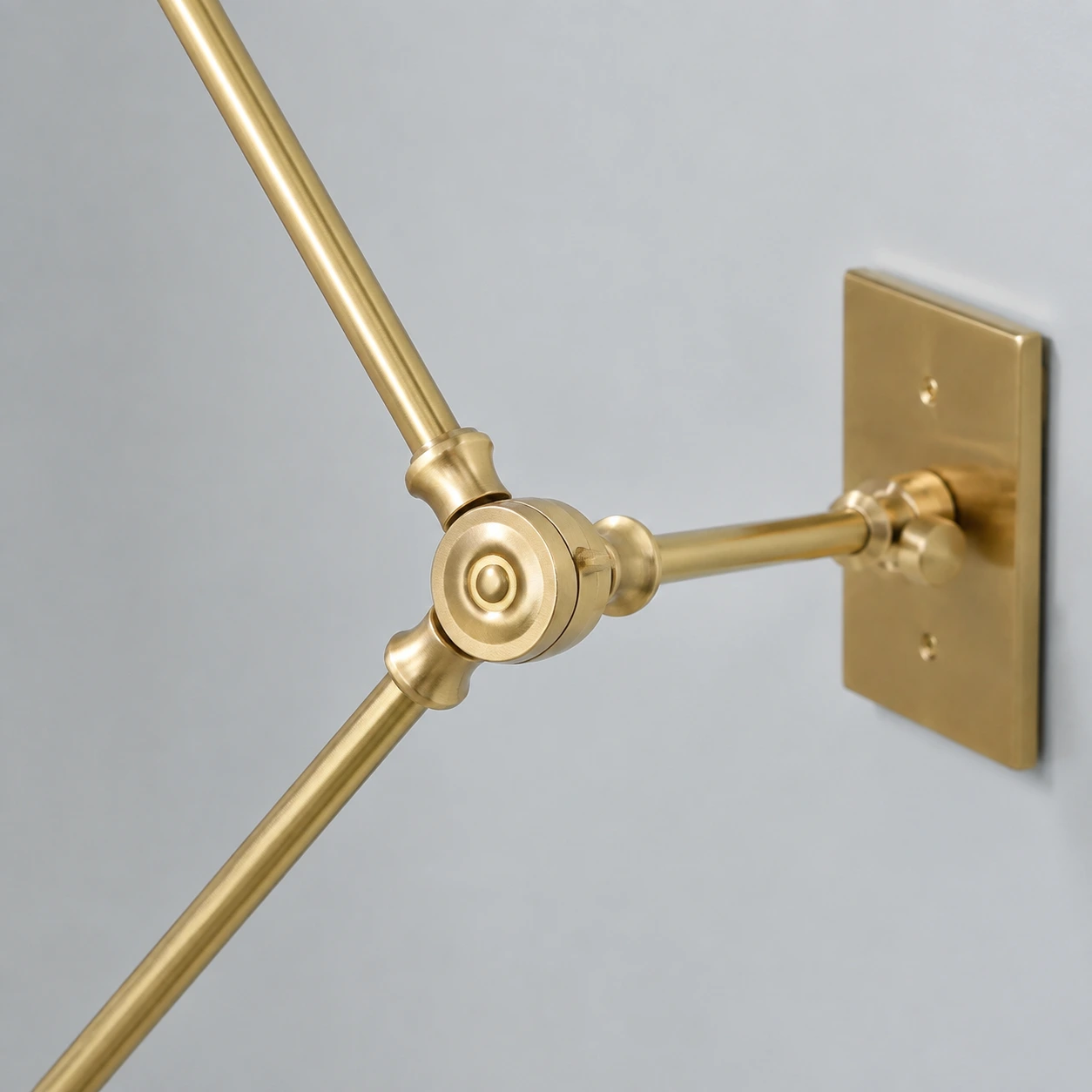 Magari wall lamp circular brass articulated joint detail