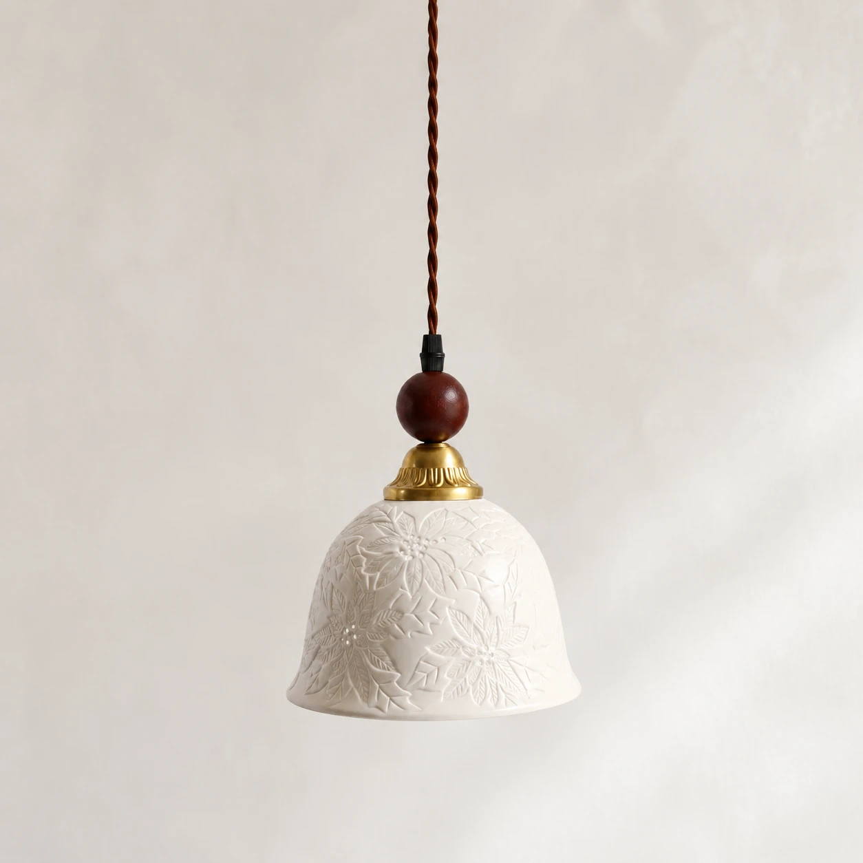 Complete single floral relief ceramic pendant in a neutral setting