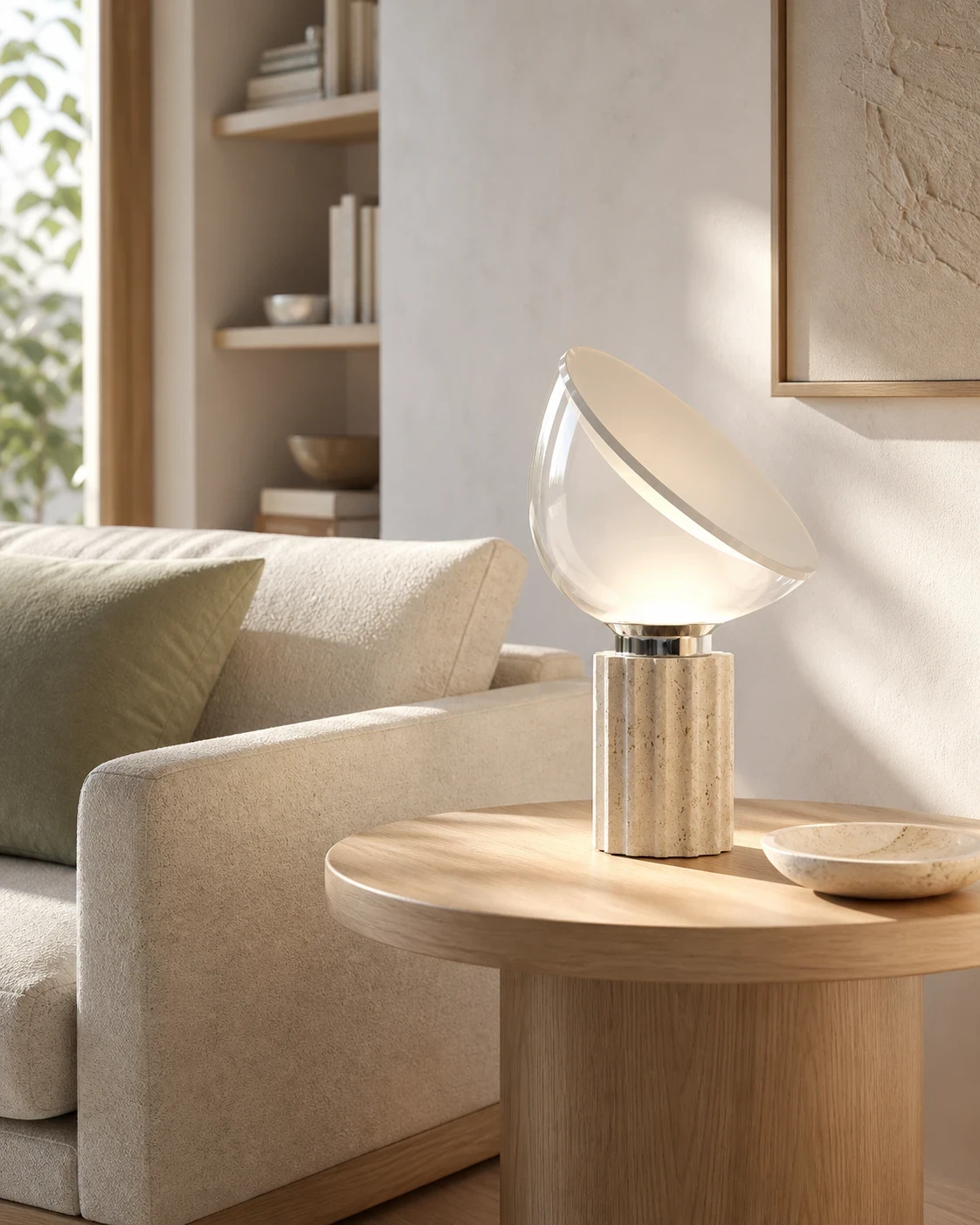 Fluted travertine lamp beside a sofa.