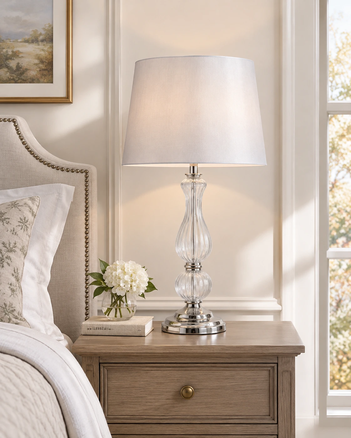 Bradshaw glass table lamp on a spacious bedroom nightstand