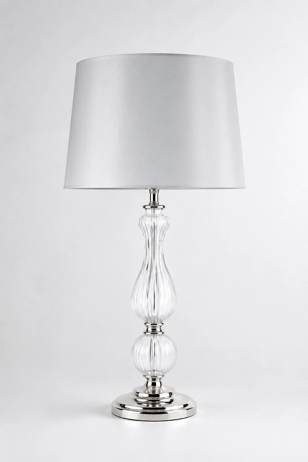 Bradshaw ribbed glass table lamp on a pearl-white studio background