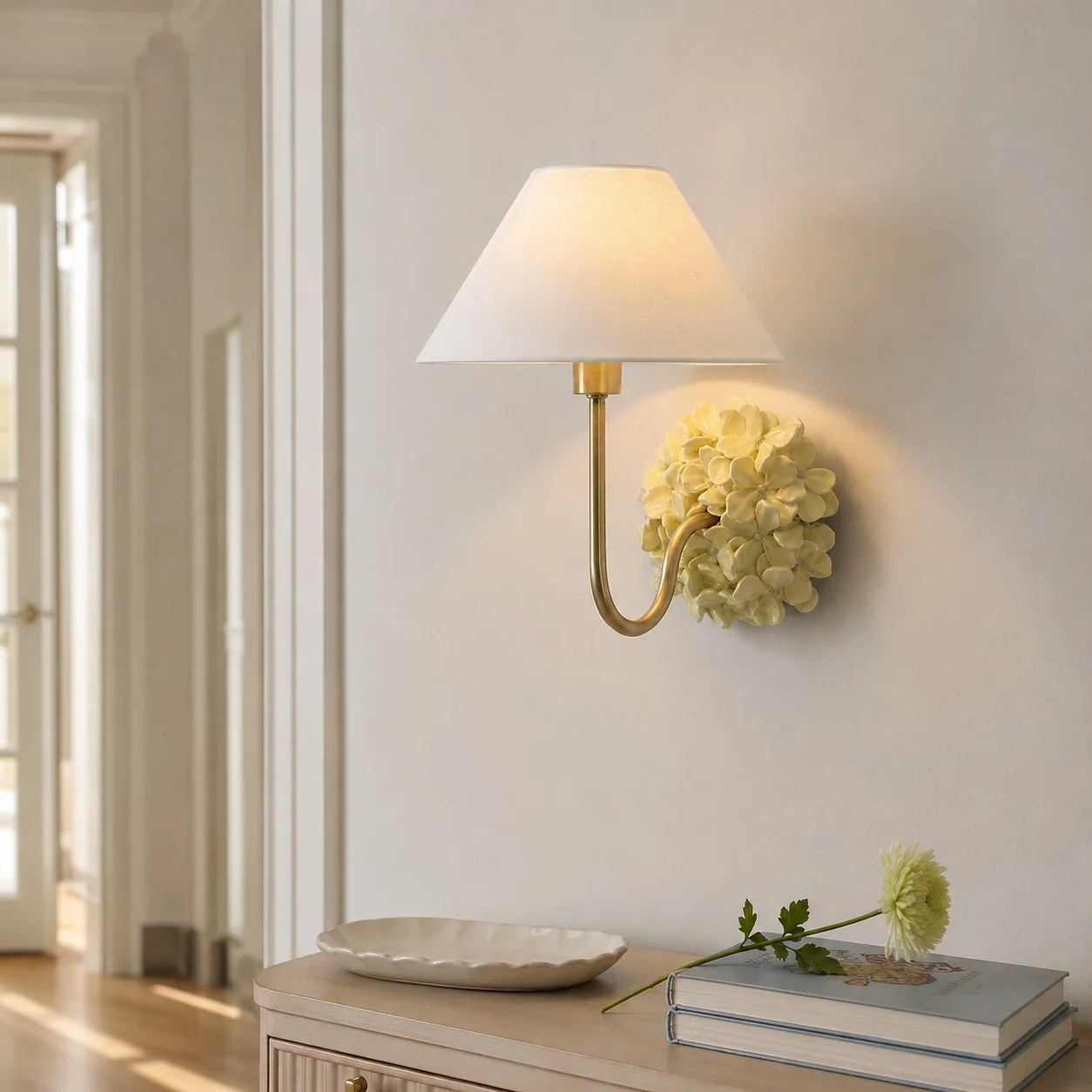 Yellow Florienne wall sconce in a bright hallway setting
