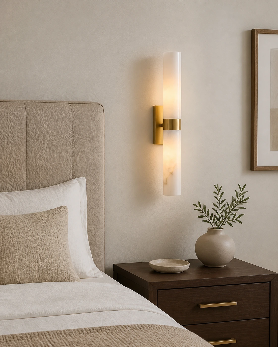 Dani alabaster double-tube sconce beside a bedroom headboard