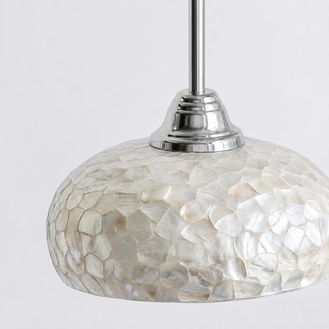 Close view of polished chrome hardware joining the shell shade