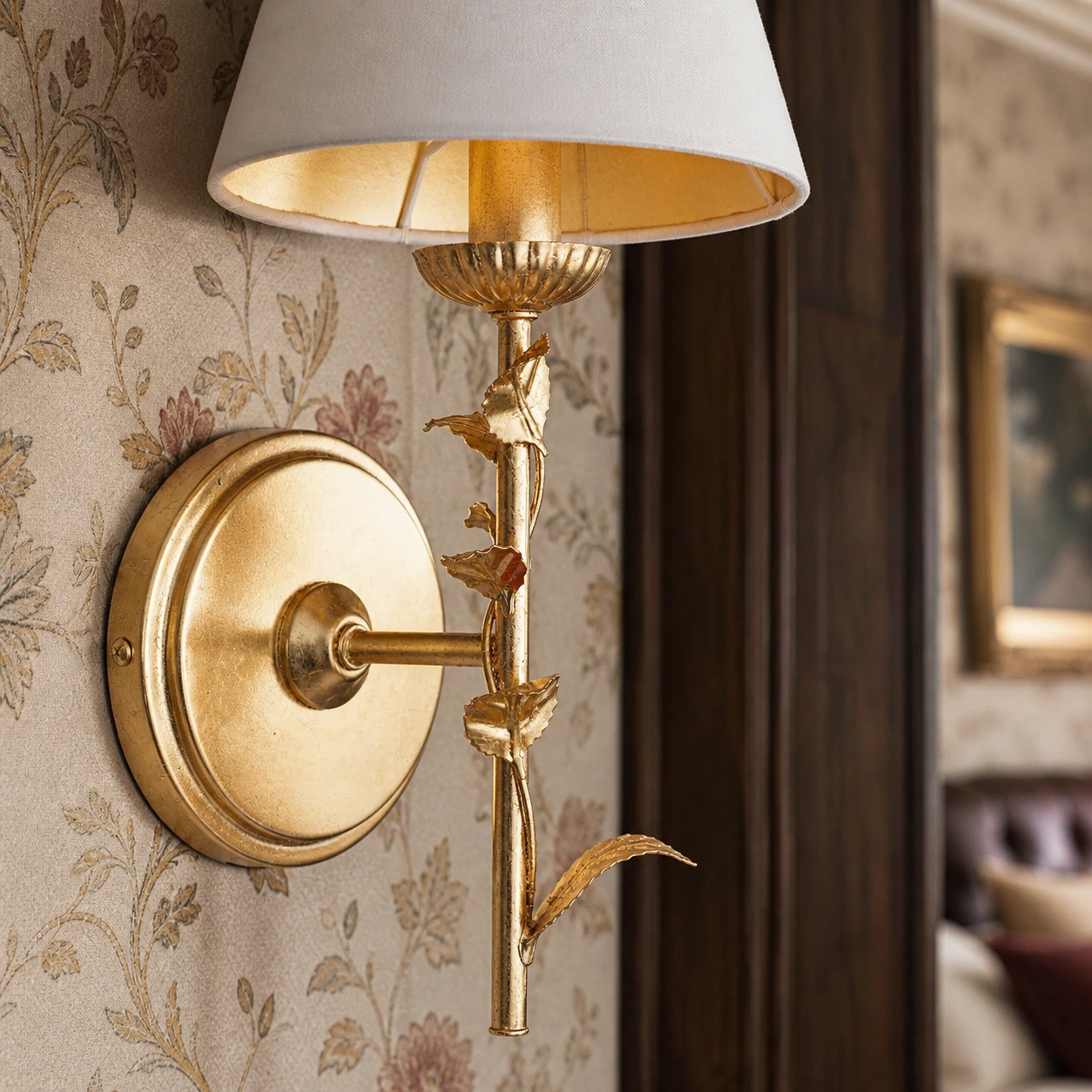 Detailed view of the sculpted leaf relief and distressed gold surface