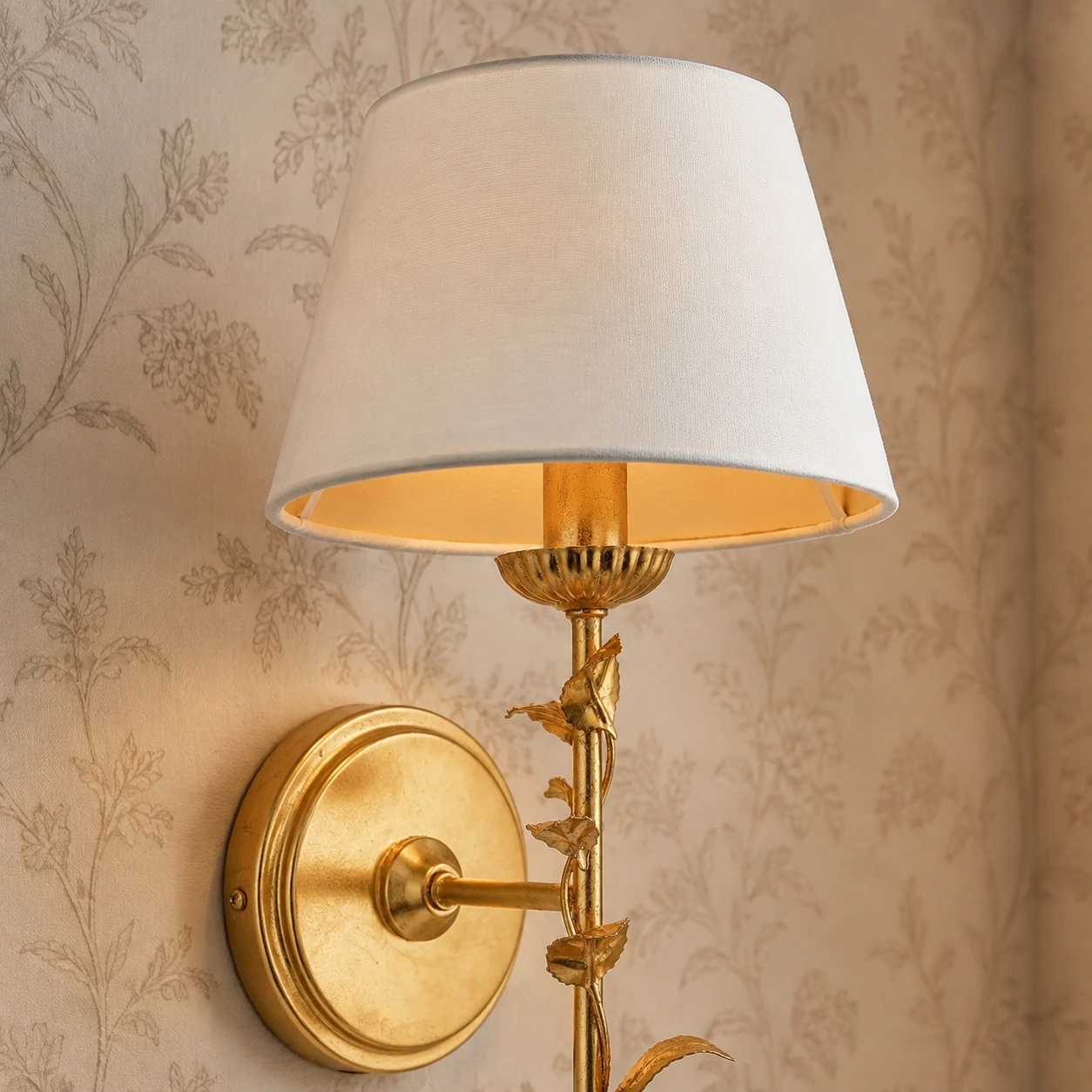 Close view of the Halton wall light white tapered fabric shade and warm inner surface