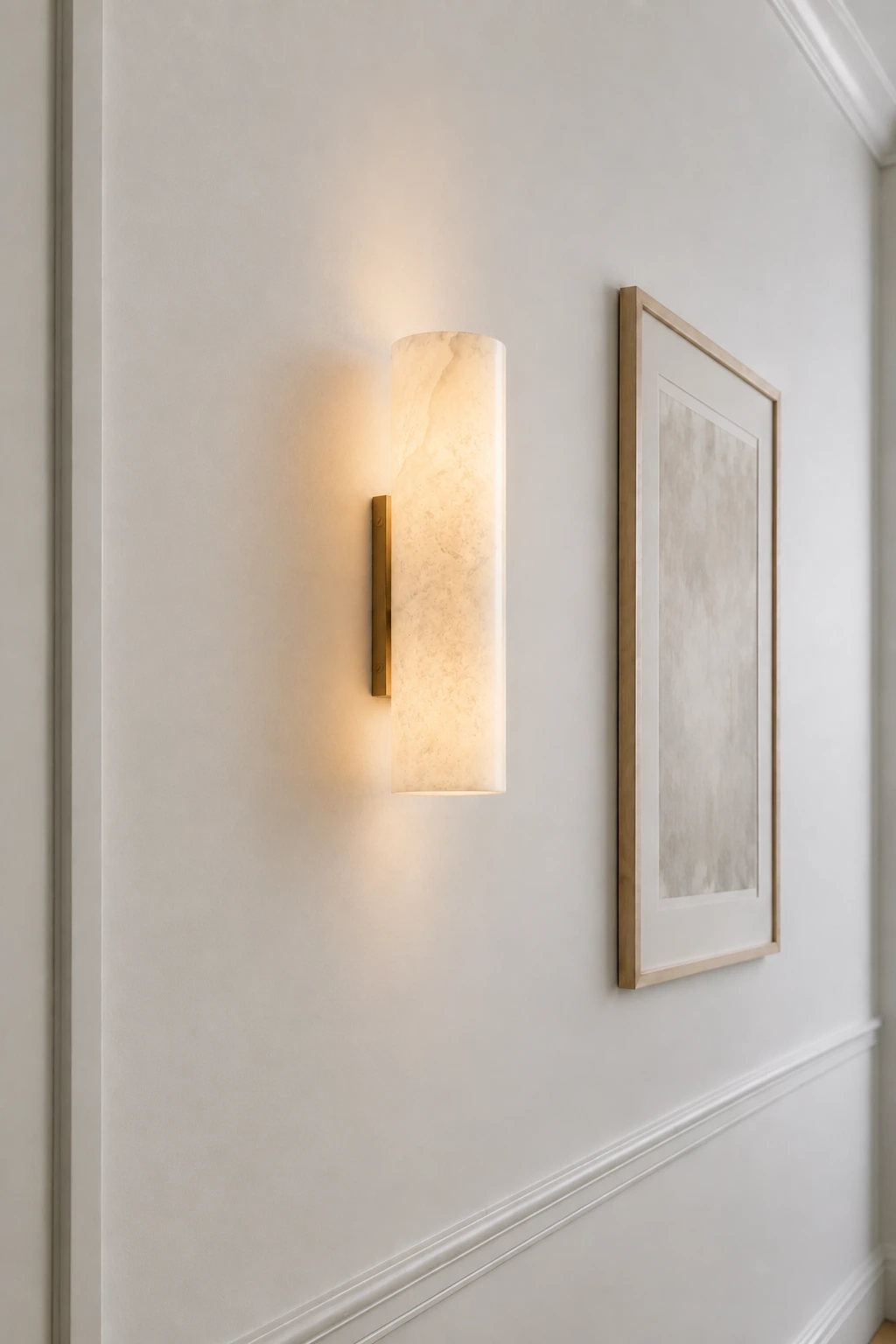 Single Brass Doran sconce viewed from an architectural side angle