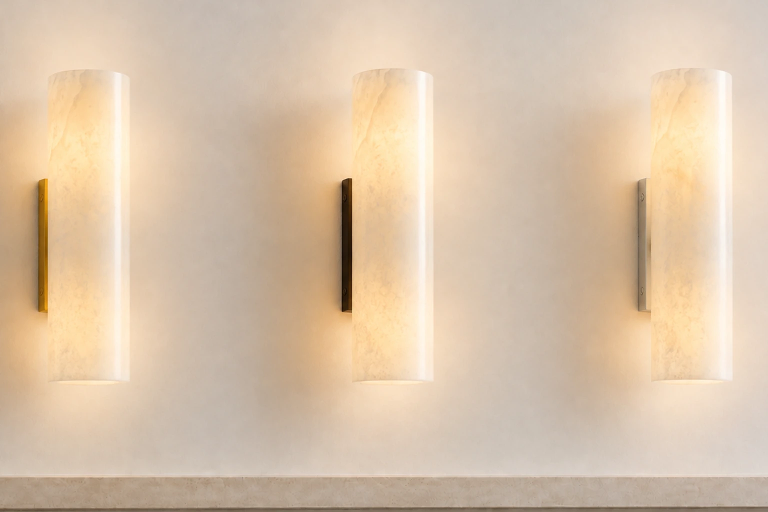 Tight studio comparison of Doran sconces in Brass, Bronze and Nickel finishes