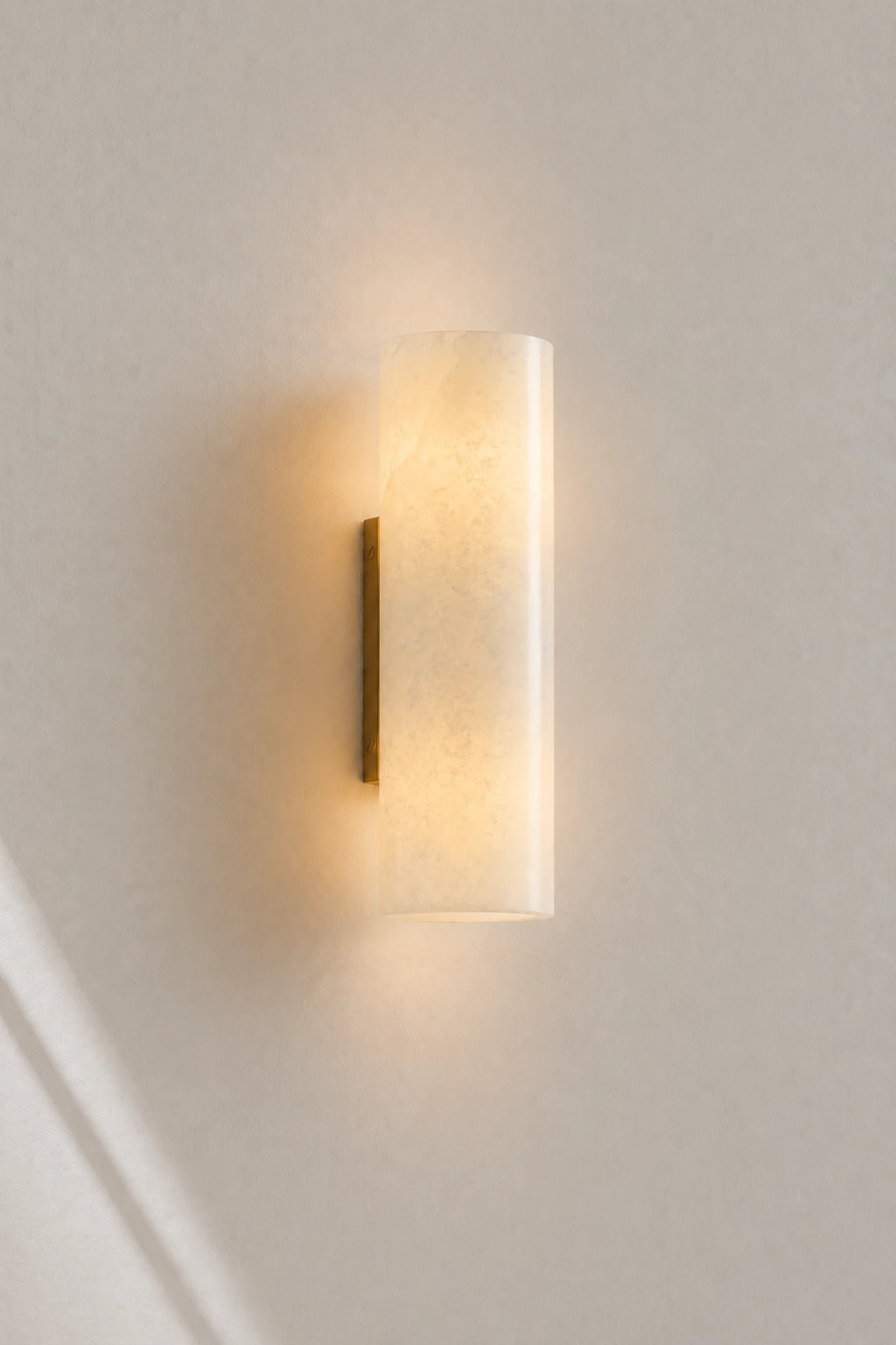 Single Brass Doran sconce in a cool architectural studio setting