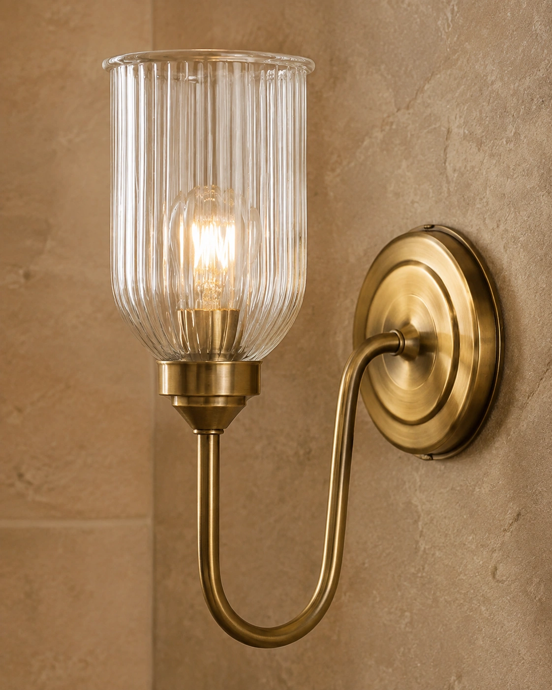 Close view of Menae ribbed glass, bulb and antique brass holder