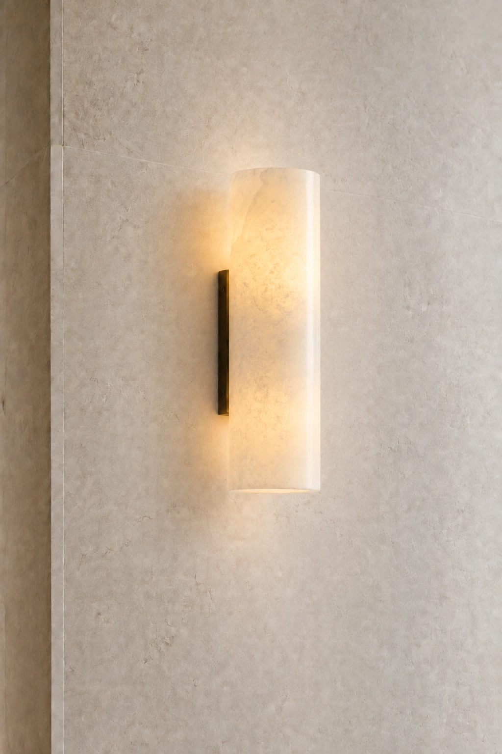 Single Bronze Doran sconce showing stone and hardware detail