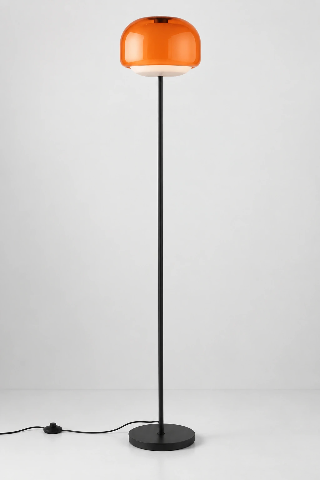 Complete orange Sanae colored glass floor lamp on a clean neutral studio background