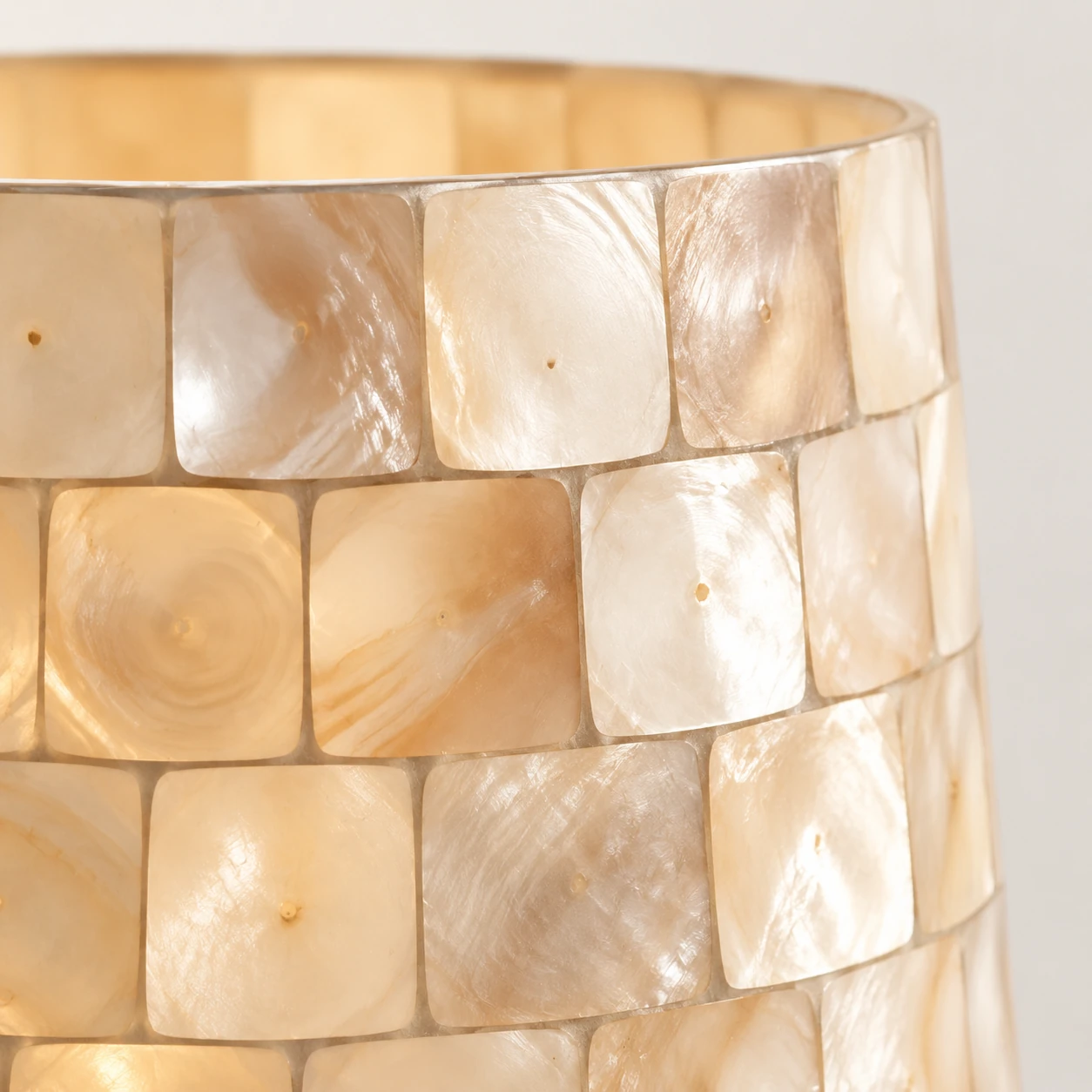 Close-up of curved shell tiles and pearlescent surface variation