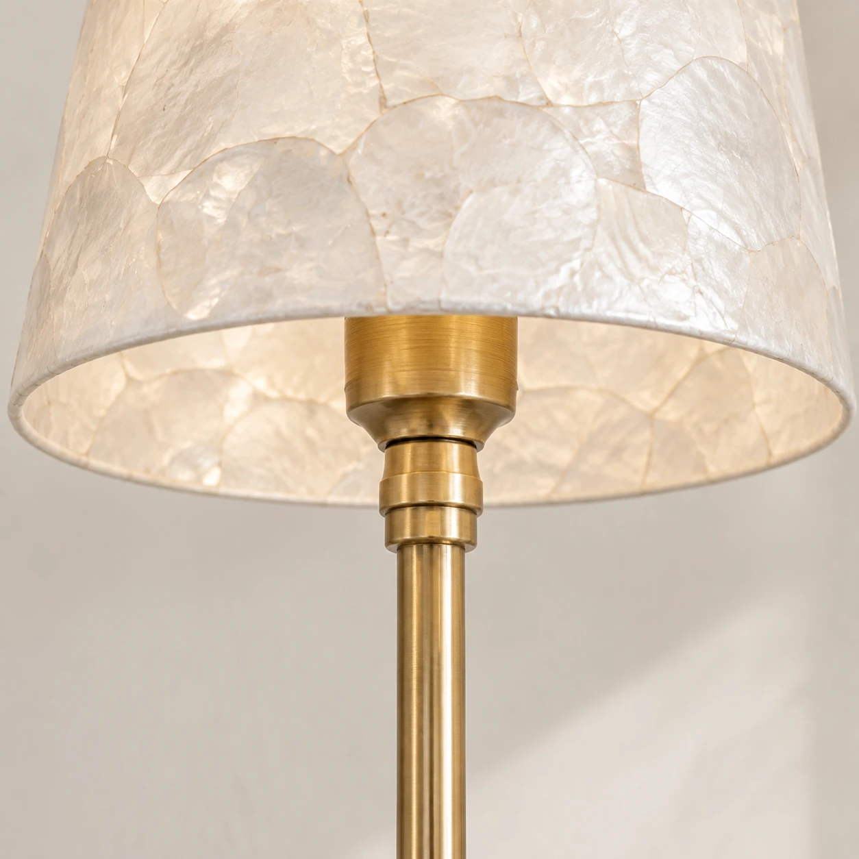 Underside of the shell shade and its brass neck connection