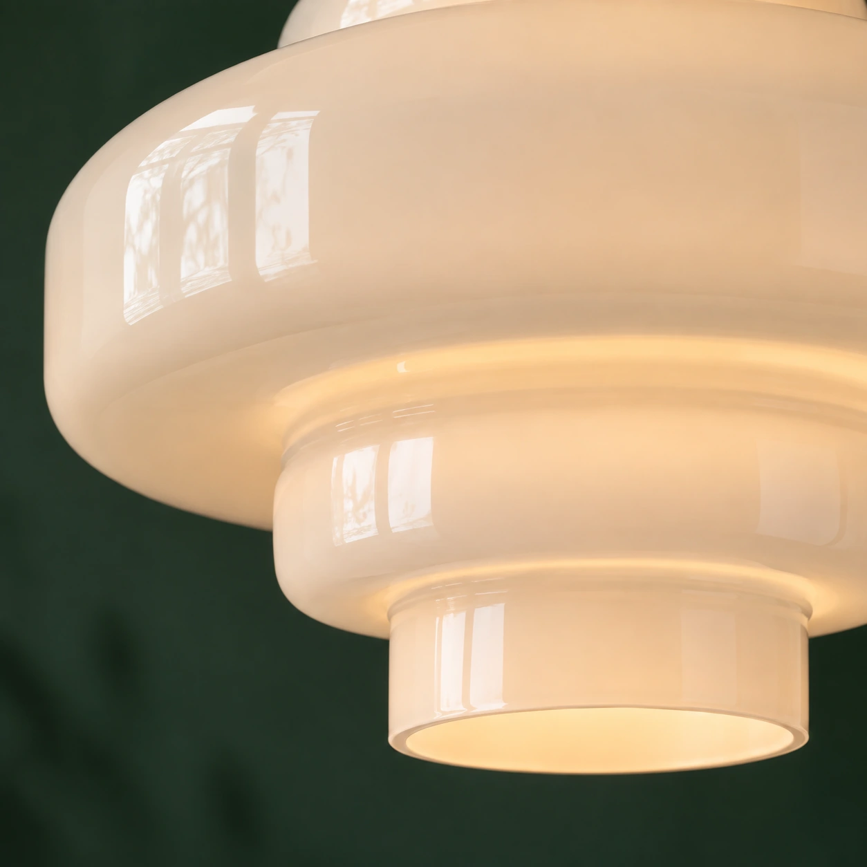 Illuminated lower opening and rounded white glass tiers