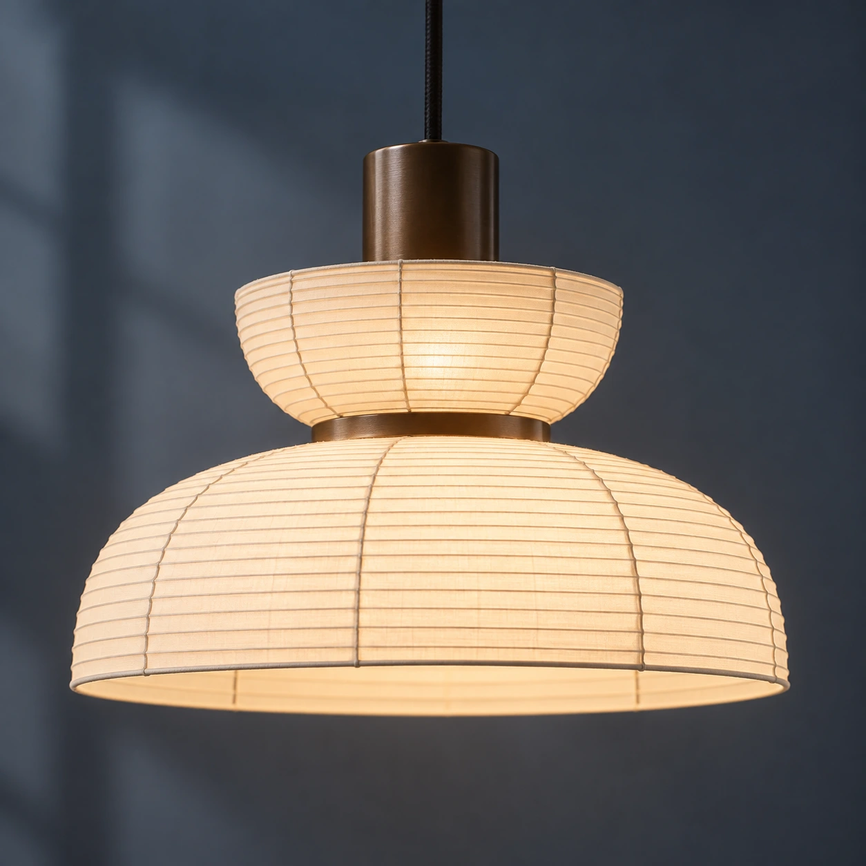 Illuminated Renée Style A fabric shade with a smaller upper bowl and a broad lower dome