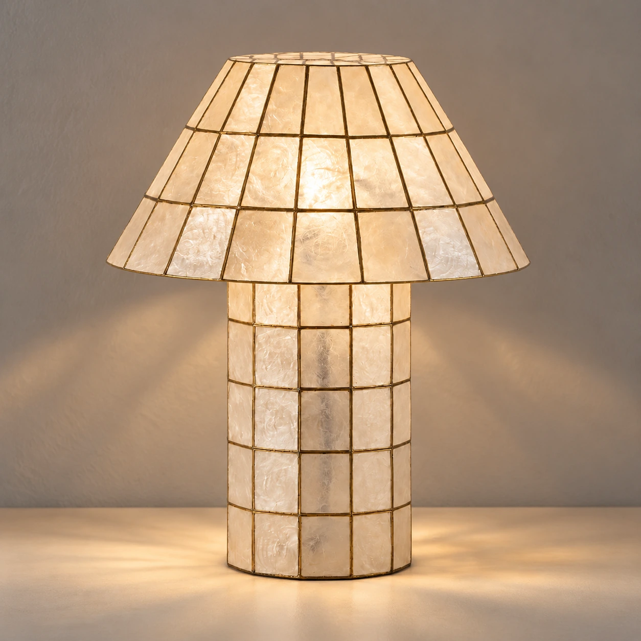 Soft light passing through the paneled shell shade