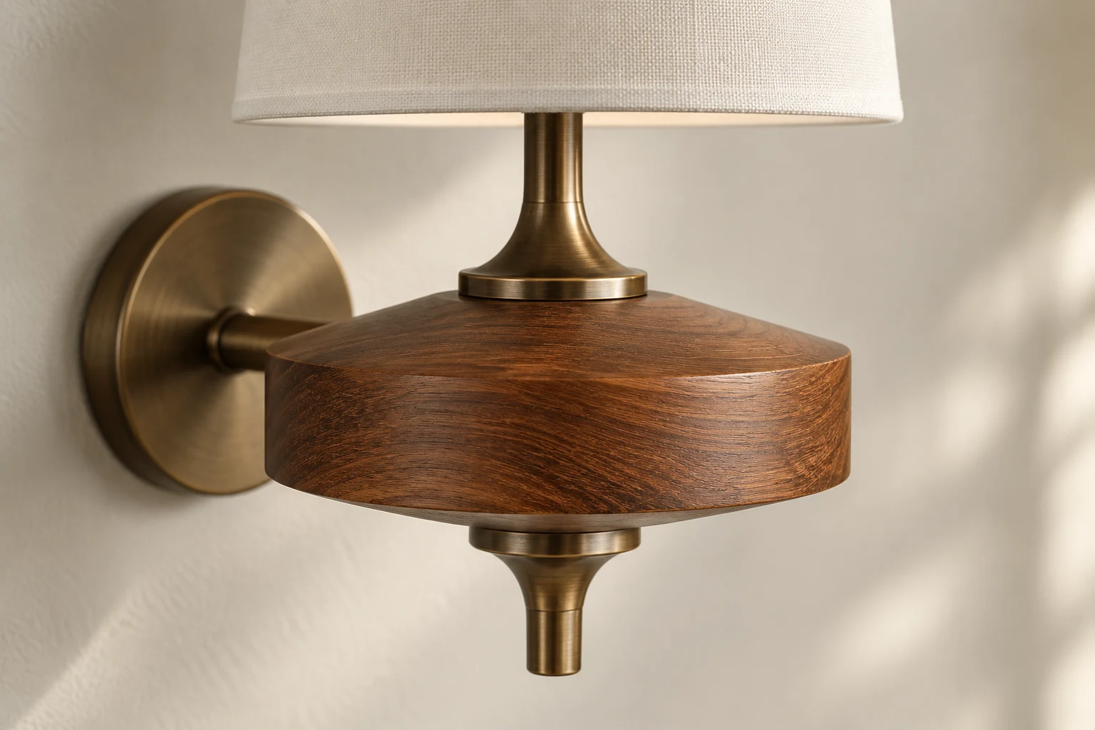 Close-up of wooden body and antique brass connection on wall sconce