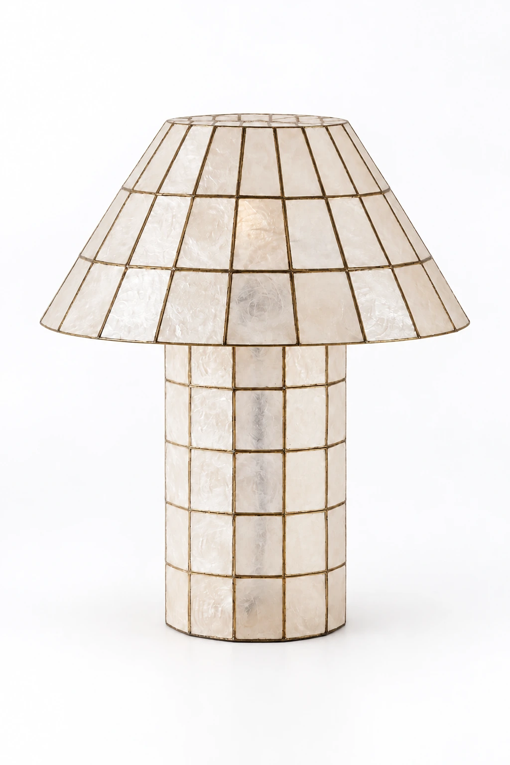 Full ivory shell table lamp on a clean white studio background