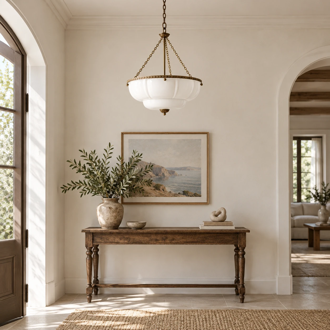 White bowl pendant above an entryway console