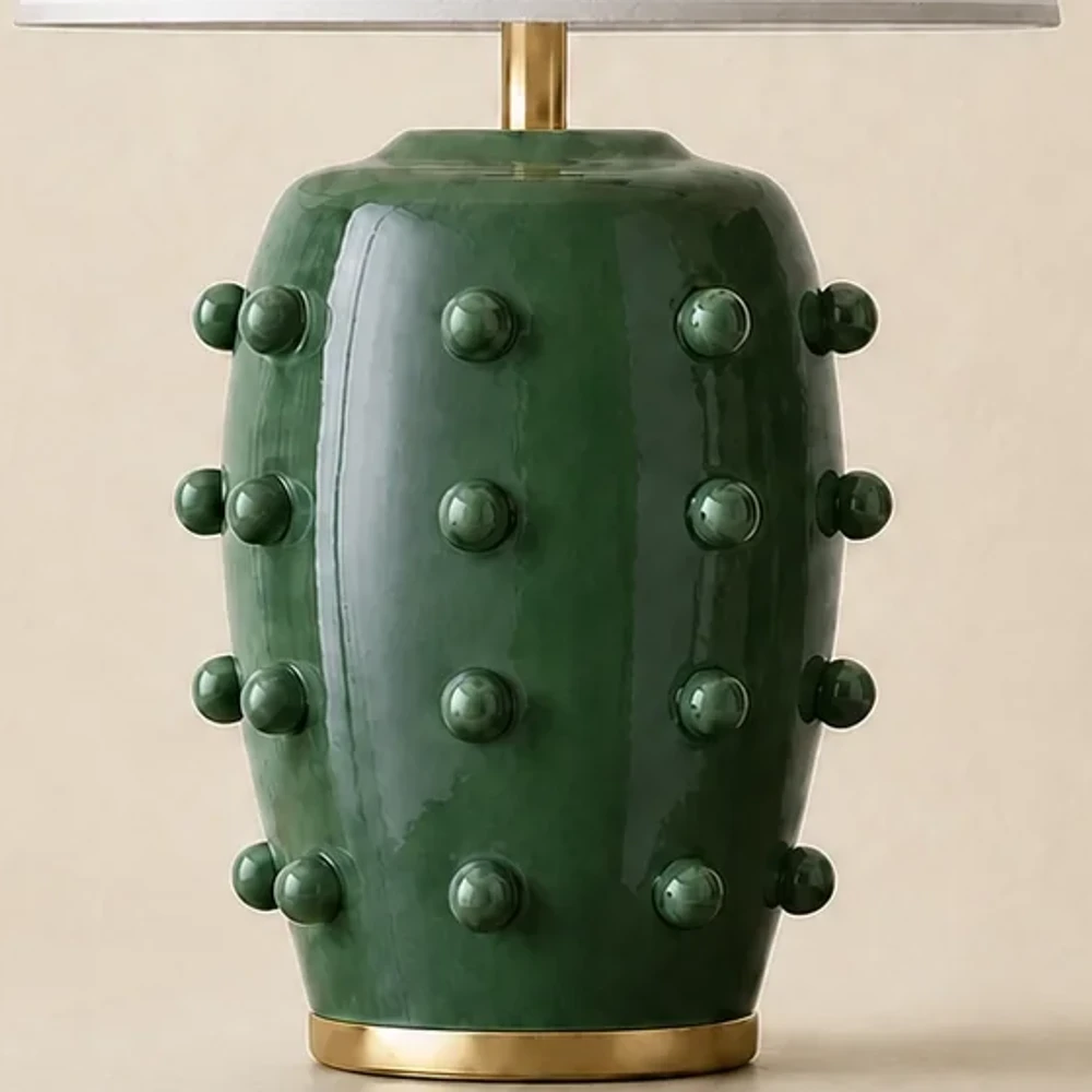 Close view of raised dots on the green glazed porcelain lamp base
