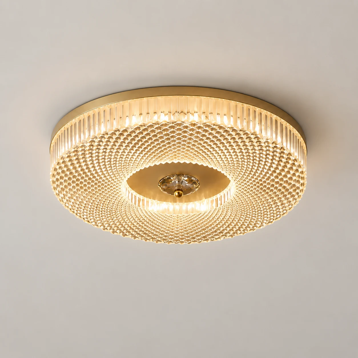Ayla LED flush mount ceiling light showing a warm illuminated finish
