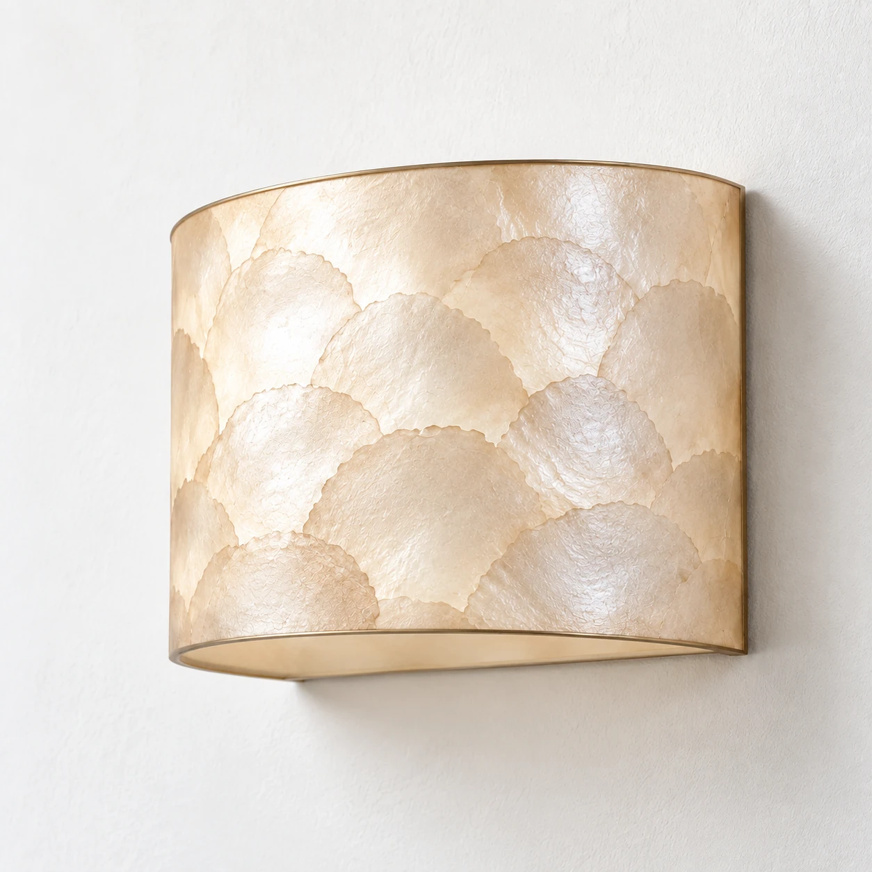 Oblique portrait showing the curved shell depth of the Aveline wall sconce