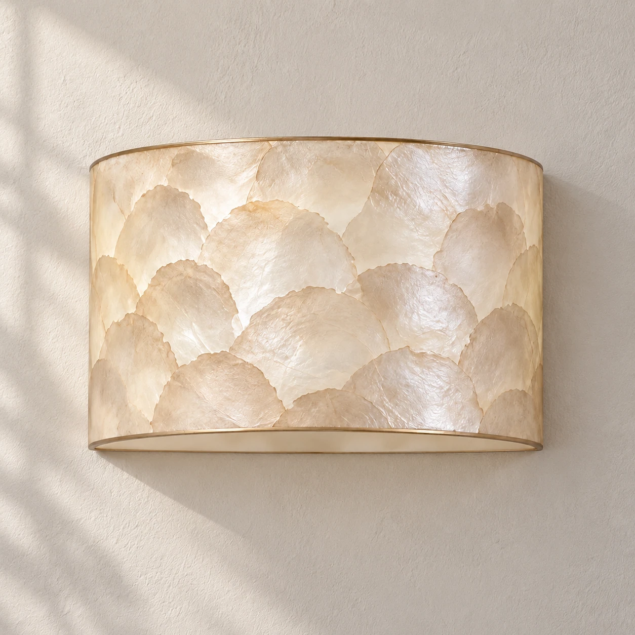 Complete front portrait of the Aveline layered shell wall sconce