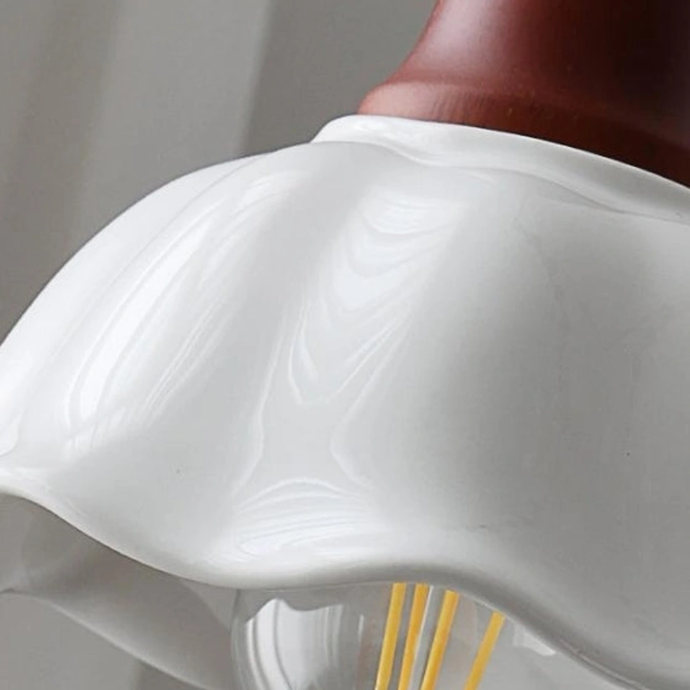 Close view of the scalloped ceramic flower shade